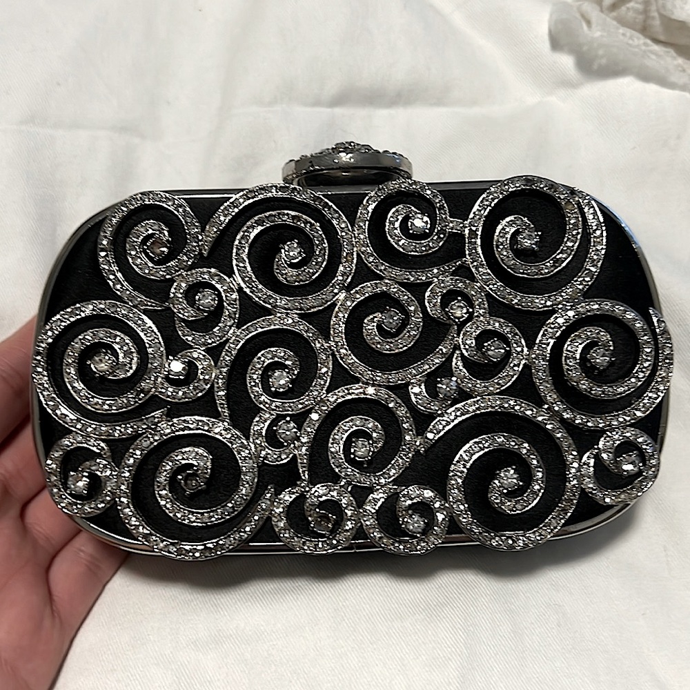 Jewels embalished black clutch , some stones are missing over all good condition